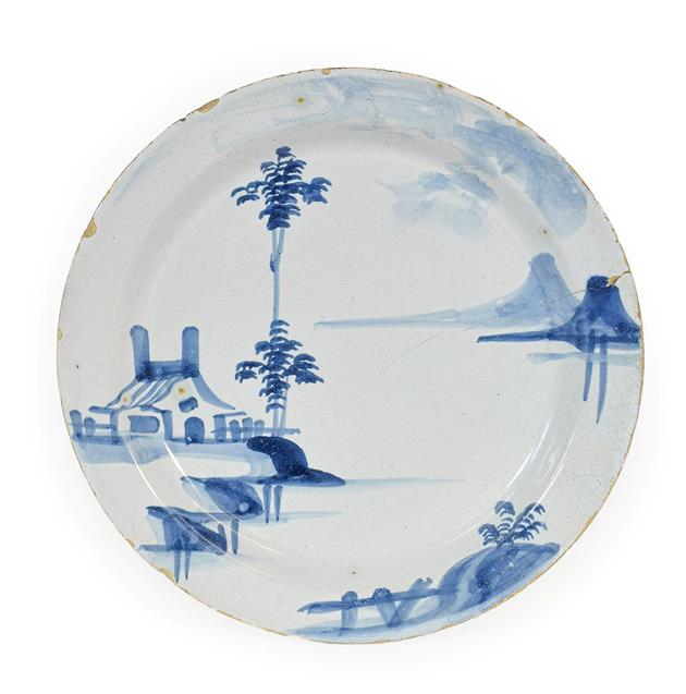 Lot 25 - An English Delft Pancake Plate, probably Lambeth, circa 1740, painted in blue with a...