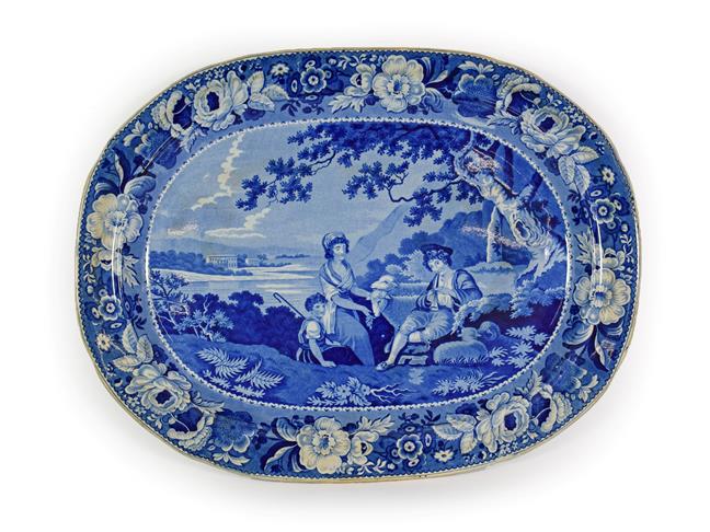 Lot 32 - A Pearlware Meat Platter, circa 1820, printed in underglaze blue with a musical shepherd...