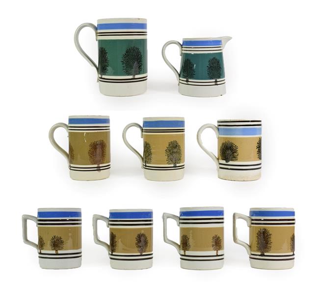 Lot 34 - A Set of Four Mochaware Small Mugs, late 19th/early 20th century, with typical decoration on a buff