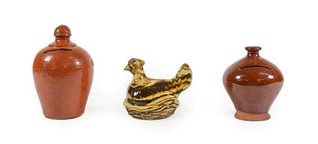 Lot 39 - An Agateware Money Box, late 19th century, in the form of a chicken on a basketweave base, 11cm...