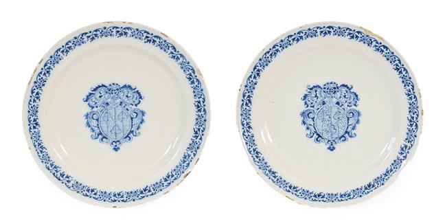 Lot 54 - A Pair of Moustiers Faience Armorial Plates, circa 1730, painted in blue with arms within...
