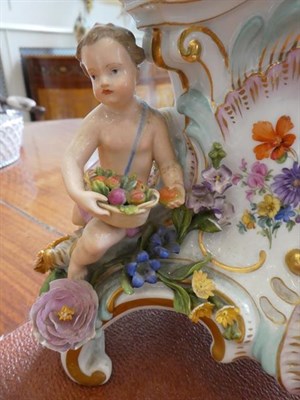 Lot 68 - A Meissen Porcelain Seven-Light Figural Candelabrum, late 19th century, with flower encrusted...
