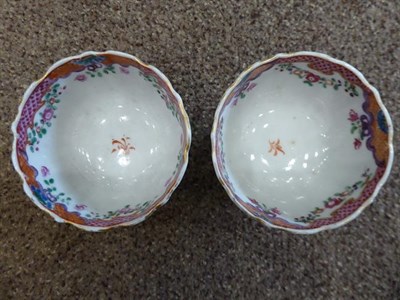 Lot 70 - A Chinese Porcelain Miniature Coffee Cup and Two Saucers, Qianlong, painted in famille rose enamels