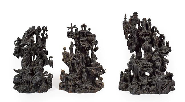 Lot 88 - A Chinese Rootwood Three Piece Garniture, late 19th century, carved with figures and buildings...