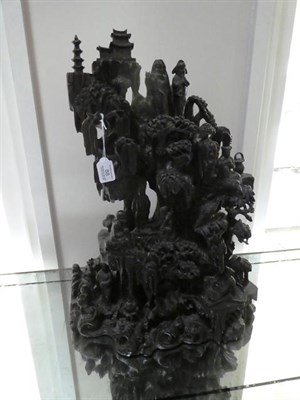 Lot 88 - A Chinese Rootwood Three Piece Garniture, late 19th century, carved with figures and buildings...