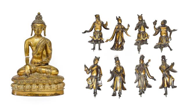 Lot 90 - A Sino-Tibetan Gilt Bronze Figure of Buddha, in 17th century style, seated on a lotus cast...