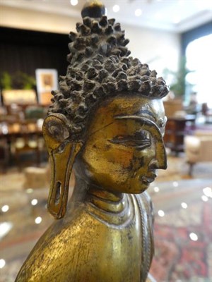 Lot 90 - A Sino-Tibetan Gilt Bronze Figure of Buddha, in 17th century style, seated on a lotus cast...
