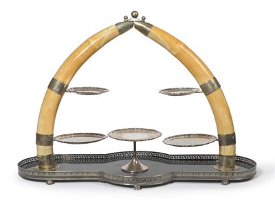 Lot 1203 - A Silver Plate Mounted Elephant Tusk Table Centrepiece Dessert Stand, circa 1930, formed as an arch