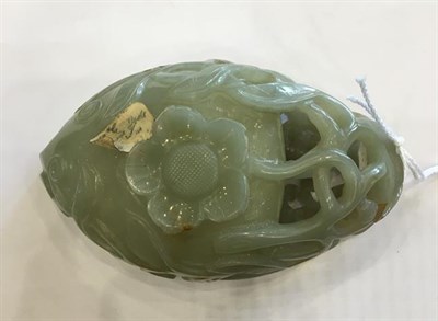 Lot 92 - A Chinese Jade Libation Cup, in the form of a peach with pierced foliate scroll handle, 12cm...