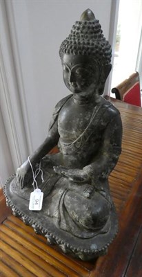 Lot 94 - A Sino-Tibetan Bronze Buddha, in 17th century style, seated cross-legged on a lotus cast base, 40cm