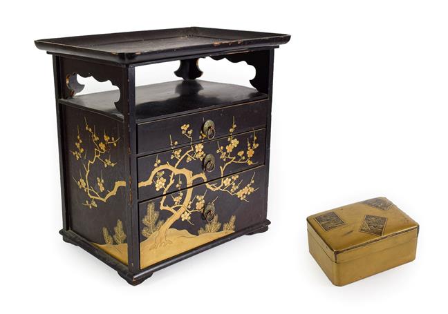 Lot 98 - A Japanese Lacquer Table Cabinet, late, with tray top over a shelf and three graduated drawers...