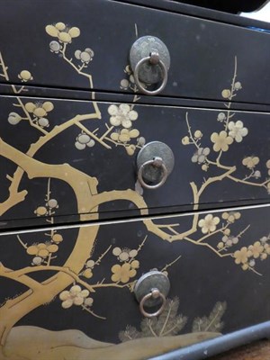 Lot 98 - A Japanese Lacquer Table Cabinet, late, with tray top over a shelf and three graduated drawers...