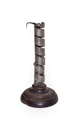 Lot 103 - A Steel Spiral Candlestick, 18th century, on a treen base, 22cm high