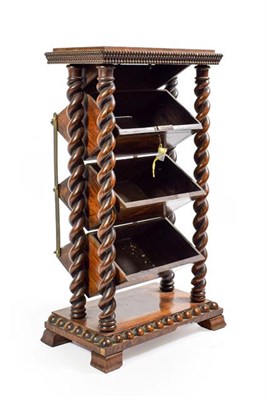 Lot 106 - An Oak Stationery Stand, circa 1900, the rectangular top over three hinged bins, supported on...