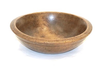 Lot 113 - A Treen Dairy Bowl, 19th century, of circular form with reeded border, 37cm diameter