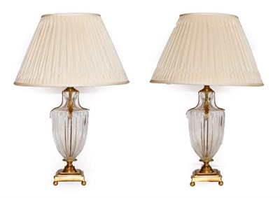 Lot 116 - A Pair of Regency-Style Gilt Metal and Cut Glass Table Lamps, modern, the moulded clear glass...