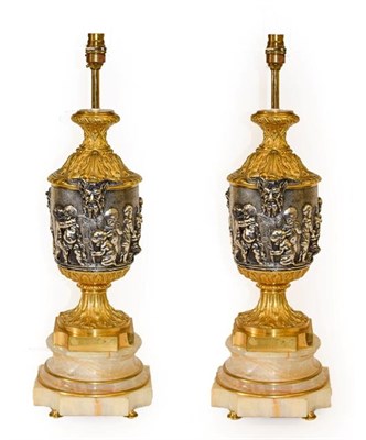 Lot 117 - A Pair of Silvered and Gilt Bronze Lamp Bases, after Clodion, of urn shape with Bacchus mask...