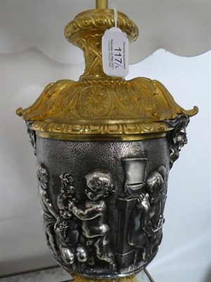 Lot 117 - A Pair of Silvered and Gilt Bronze Lamp Bases, after Clodion, of urn shape with Bacchus mask...