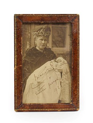 Lot 144 - A Photographic Reproduction Portrait of Queen Mary, holding her Grandson George Lascelles,...