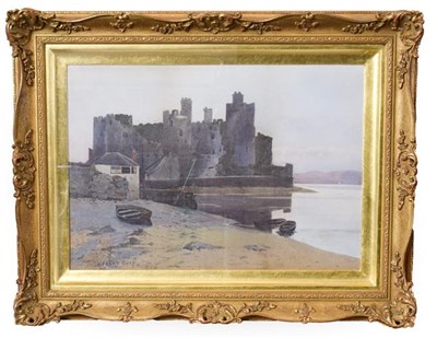 Lot 215 - Hubert Coop (1872-1953) Ruined medieval castle Possibly Conwy, by a lakeside at dusk Signed and...