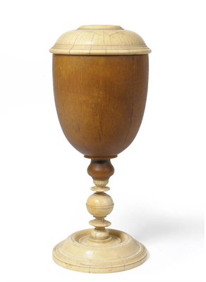 Lot 1234 - A Rhinoceros Horn and Ivory Mounted Pedestal Cup and Cover, late 17th century, the turned and domed