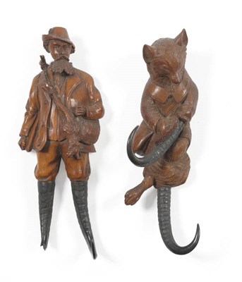 Lot 1237 - A Swiss Carved and Stained Linden Wood Coat Hook as a Fox, probably Brienz, circa 1900, the fox...