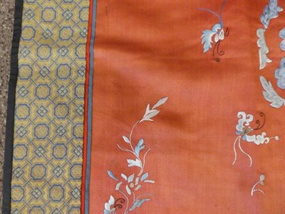 Lot 304 - A Chinese Silk Embroidered Panel, 20th century, the peach ground worked with flowers and birds...