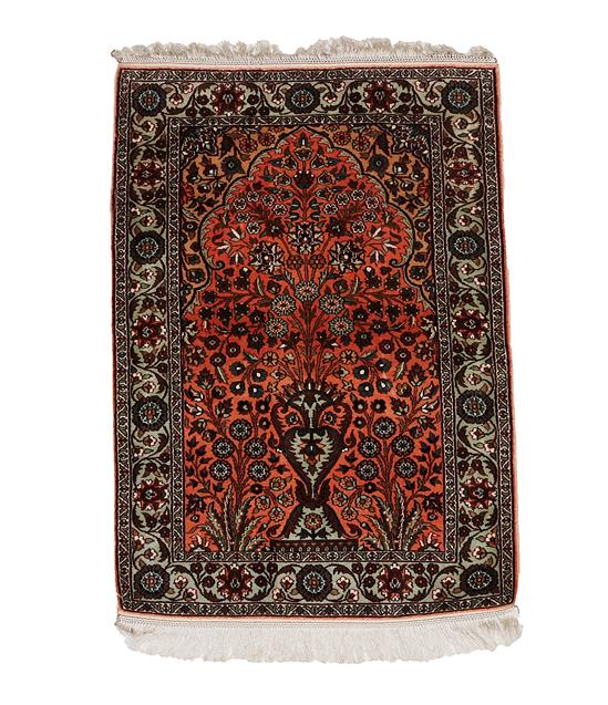 Lot 310 - Kashmir Silk Prayer Rug, modern The bright terracotta field with an urn issuing flowers beneath the