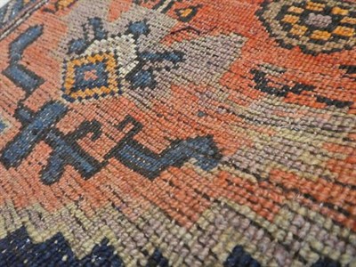 Lot 312 - North West Persian Rug, circa 1920 The deep indigo field with stepped anchor medallion framed...