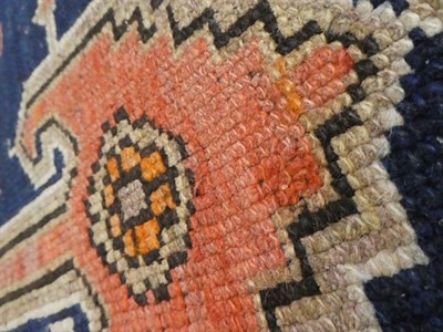 Lot 312 - North West Persian Rug, circa 1920 The deep indigo field with stepped anchor medallion framed...