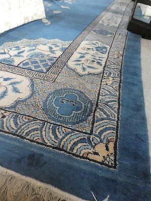 Lot 315 - A Chinese Design Carpet, possibly Turkish circa 1920 The pale indigo field with central roundel...