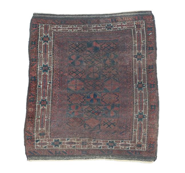 Lot 318 - Baluch Rug West Afghanistan, 19th century The compartmentalised field of stylised flowerheads...