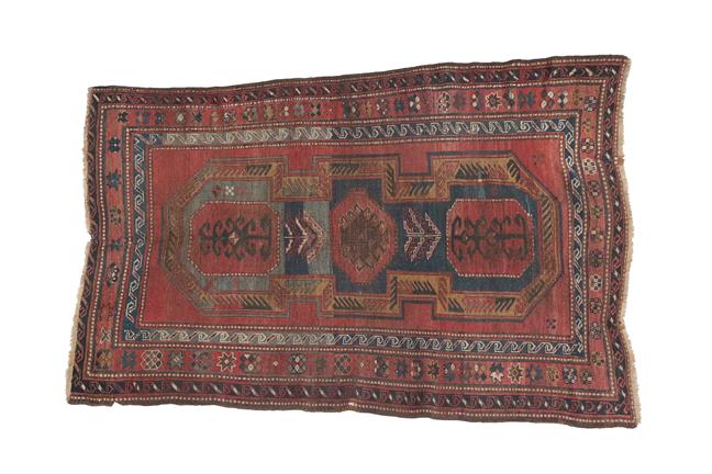 Lot 320 - Kazak Rug Central Caucasus, circa 1900 The deep terracotta field with central 'shield' enclosed...