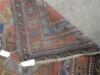 Lot 320 - Kazak Rug Central Caucasus, circa 1900 The deep terracotta field with central 'shield' enclosed...