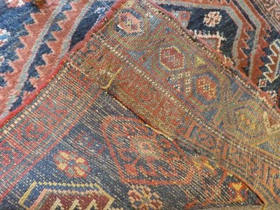 Lot 322 - Kurdish Rug West Iran, circa 1920 The indigo field with two serrated medallions enclosed by...