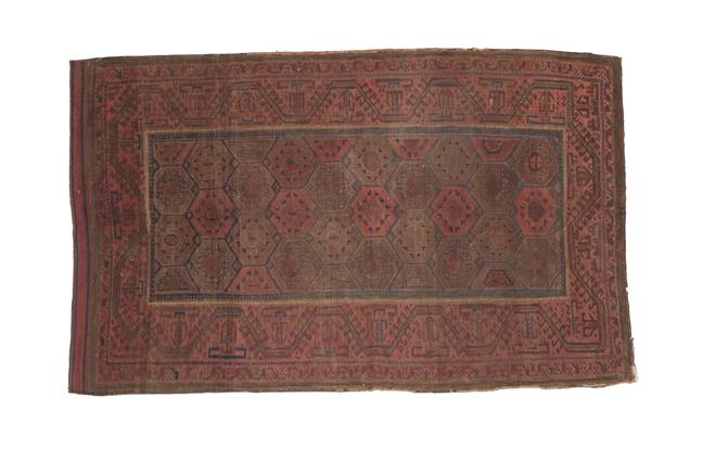 Lot 323 - Baluch Rug Iranian/Afghan Frontier, 19th century The honeycomb lattice field enclosed by...