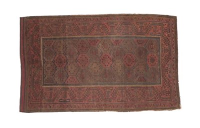Lot 323 - Baluch Rug Iranian/Afghan Frontier, 19th century The honeycomb lattice field enclosed by...