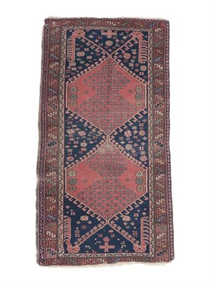 Lot 329 - Isparta Rug Central Anatolia, circa 1900 The deep indigo field with two hooked medallions...