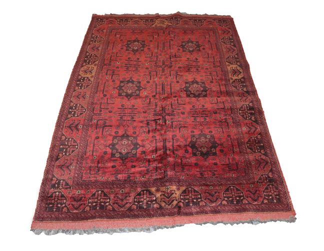 Lot 332 - Afghan Turkmen Rug The compartmentalised field enclosed by narrow borders, 195cm by 128cm