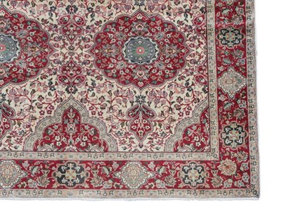 Lot 345 - Pair of Tabriz Carpets North West Iran, modern Each with an ivory field and large crimson...