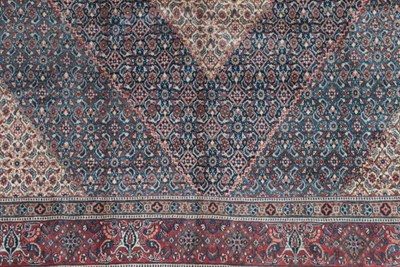 Lot 361 - Moud Khorasan Carpet East Iran, 20th century The indigo Herati field enclosed by brick red...