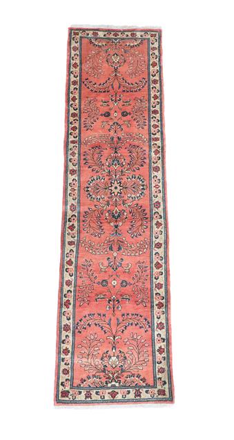 Lot 366 - Saroukh Runner  West Iran, circa 1960 The coral pink field with a column of flowering plants...