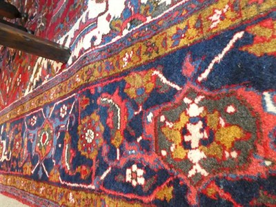 Lot 374 - Ahar Heriz Carpet Iranian Azerbaijan, circa 1950 The crimson field with flowerhead medallion...