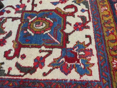 Lot 374 - Ahar Heriz Carpet Iranian Azerbaijan, circa 1950 The crimson field with flowerhead medallion...