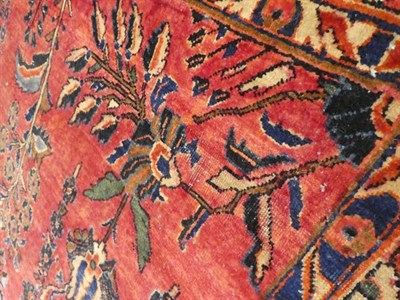Lot 375 - Saroukh Carpet West Iran, circa 1930 The faded strawberry field of angular plants around a...