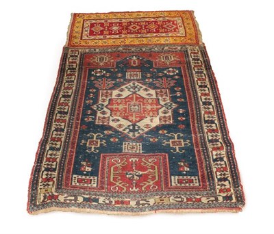 Lot 376 - East Caucasian Prayer Rug, circa 1890, the indigo field with central panel beneath the Mihrab...