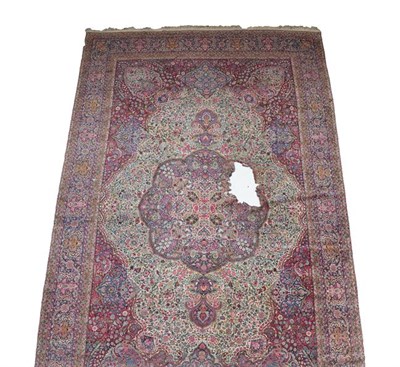 Lot 380 - Large Ravar Kirman Carpet South East Iran, circa 1925 The ivory field richly decorated with...