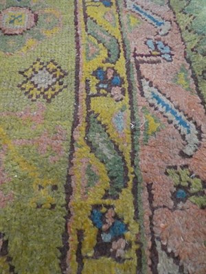 Lot 381 - Ushak Carpet Central/West Anatolia, circa 1900 The faded olive green field with columns of...