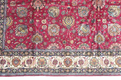 Lot 383 - Tabriz Carpet Iranian Azerbaijan, circa 1950 The deep raspberry field with an allover design of...
