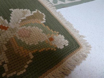 Lot 387 - Portuguese Flatweave Carpet, 2nd half 20th century The cream field of flowering plants around a...
